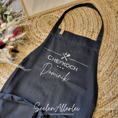 Schürze mit dem Aufdruck Chefkoch Dominik