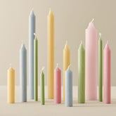 Kerzen in frühlingsfarben hellblau, grün und gelb sowie rosa zum anzünden und dekorieren.