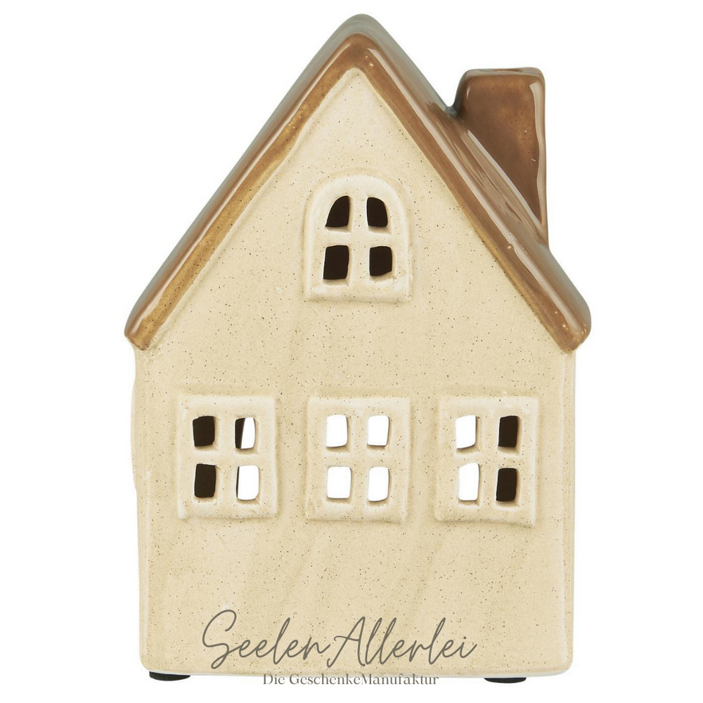 Einzelnes Keramikhaus für Teelicht in hellem Beige mit braunem Dach im skandinavischen Design